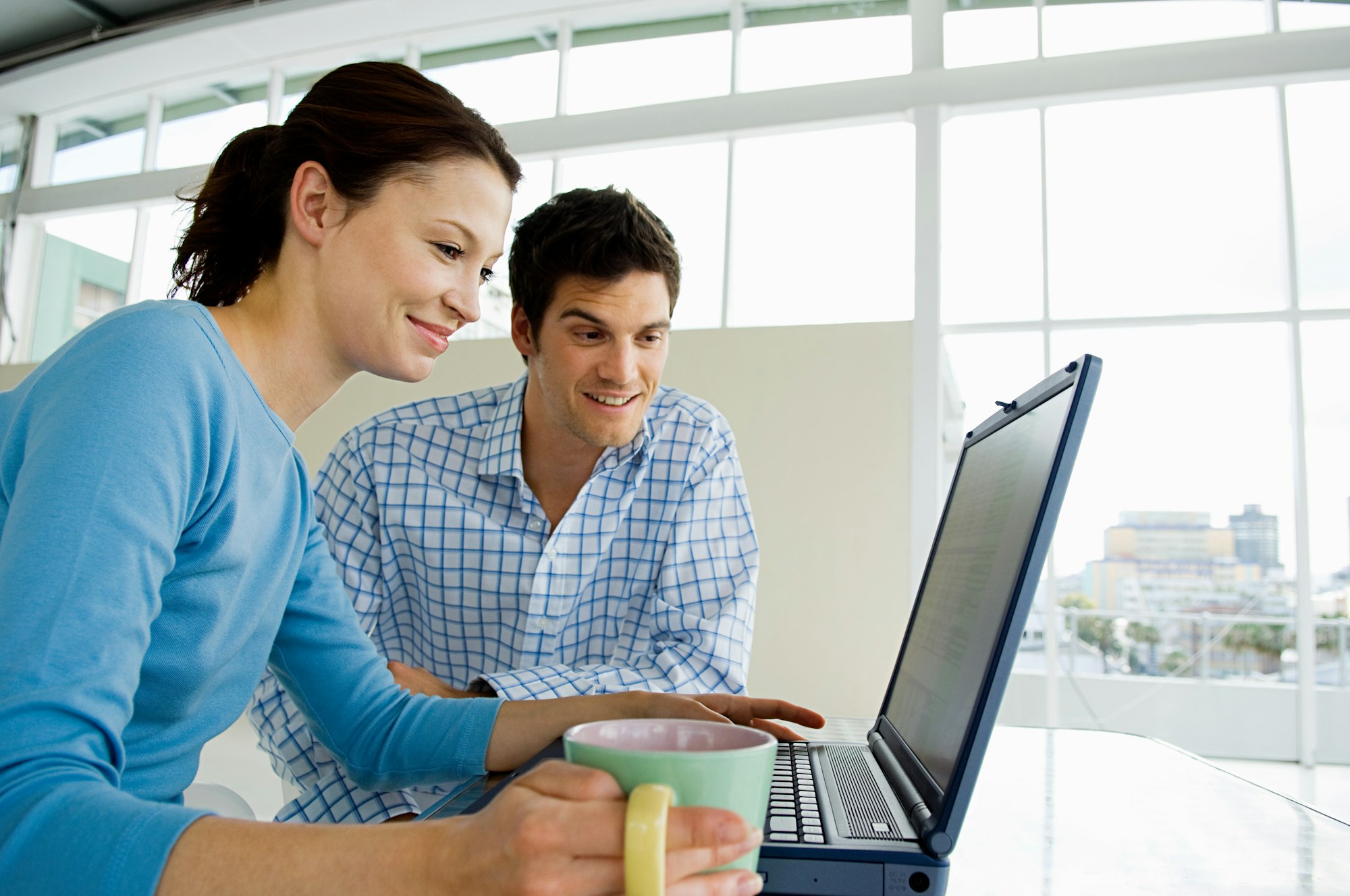 Couple using laptop