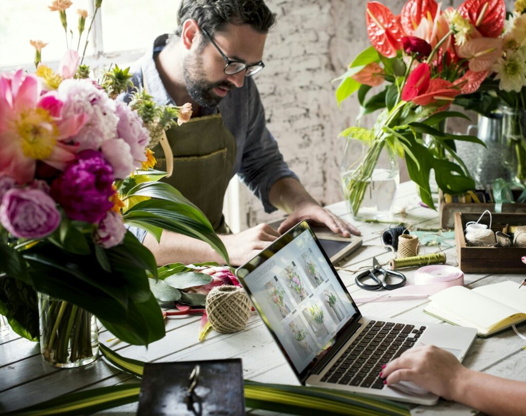 Flower shop business owner working service