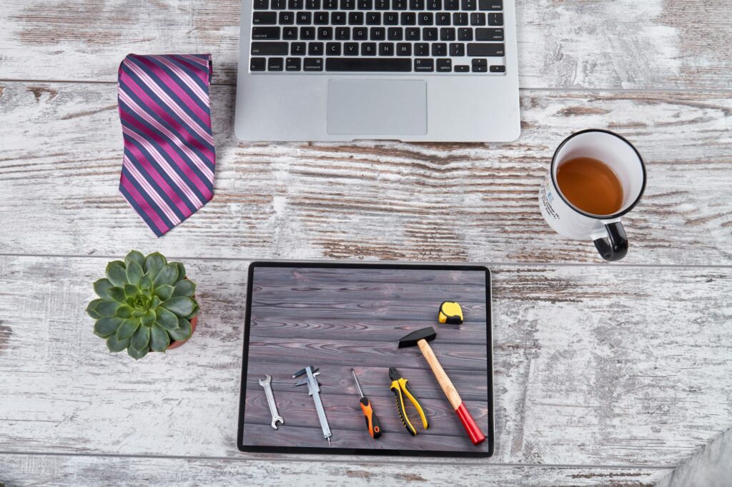 Office workplace and work tools on the tablet screen.