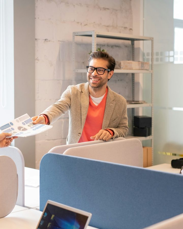 Employees working on financial report in office