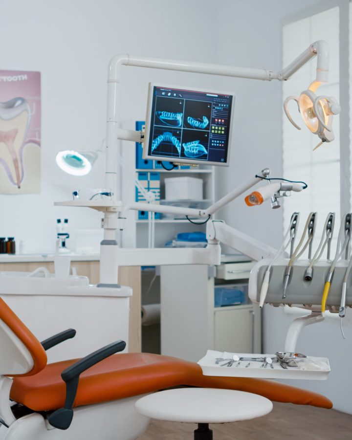 Interior of modern equipment oral office with teeth x ray on monitors, stomatology dentistry orthodontist medical clinic . Zoom in shoot. Hospital cabinet for dental health, care treatment